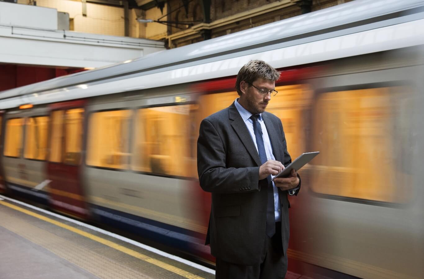 businessman waiting train station